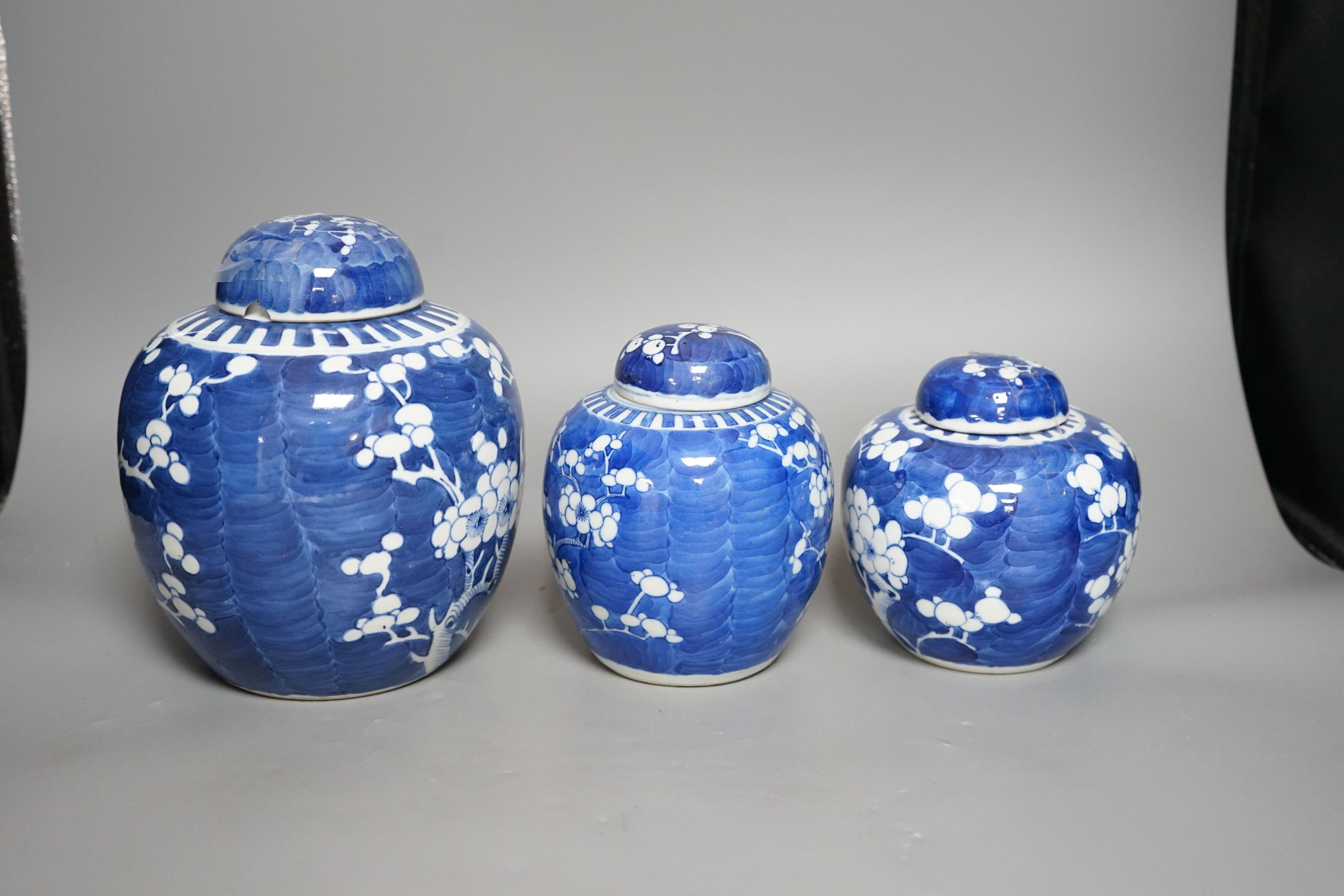 Three Chinese blue and white jars and covers, tallest 21cms high